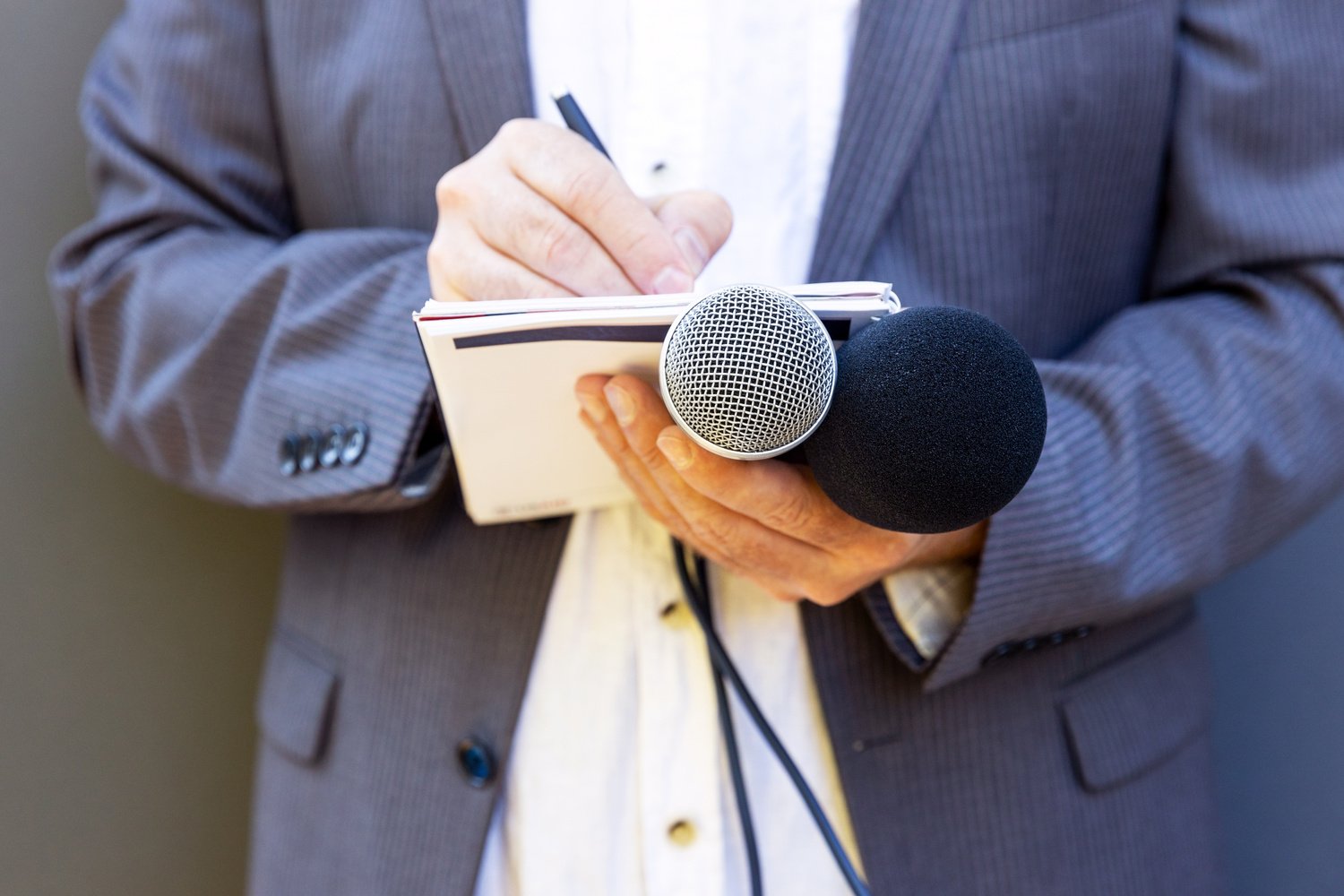 Public relation (PR) officer working at press conference or media event